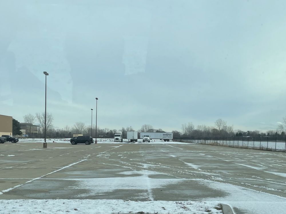 A cleared commercial parking lot after a snowfall